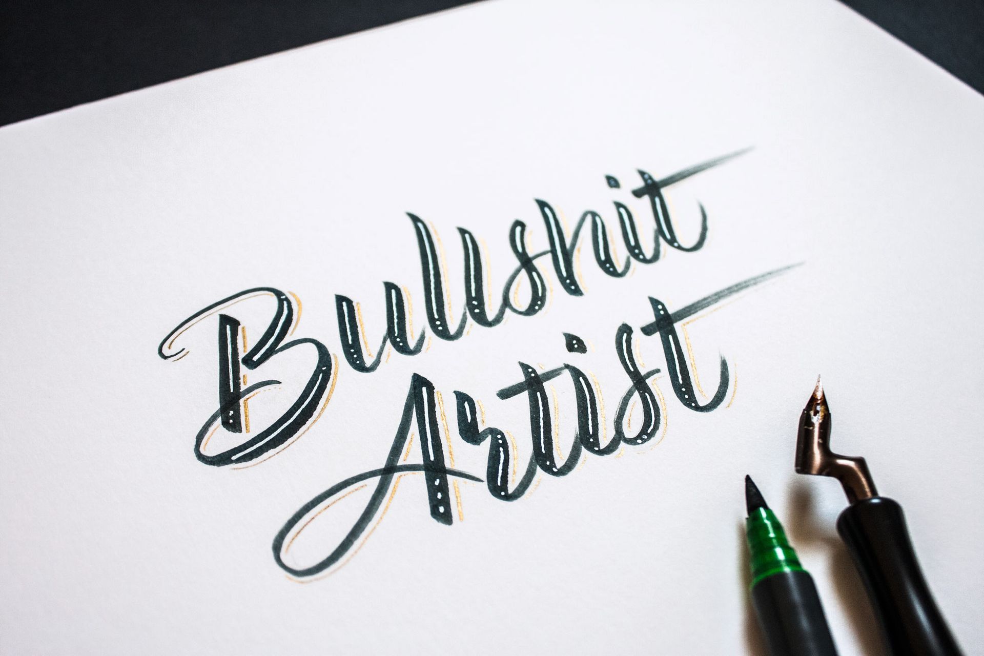 Calligraphy on white paper reads