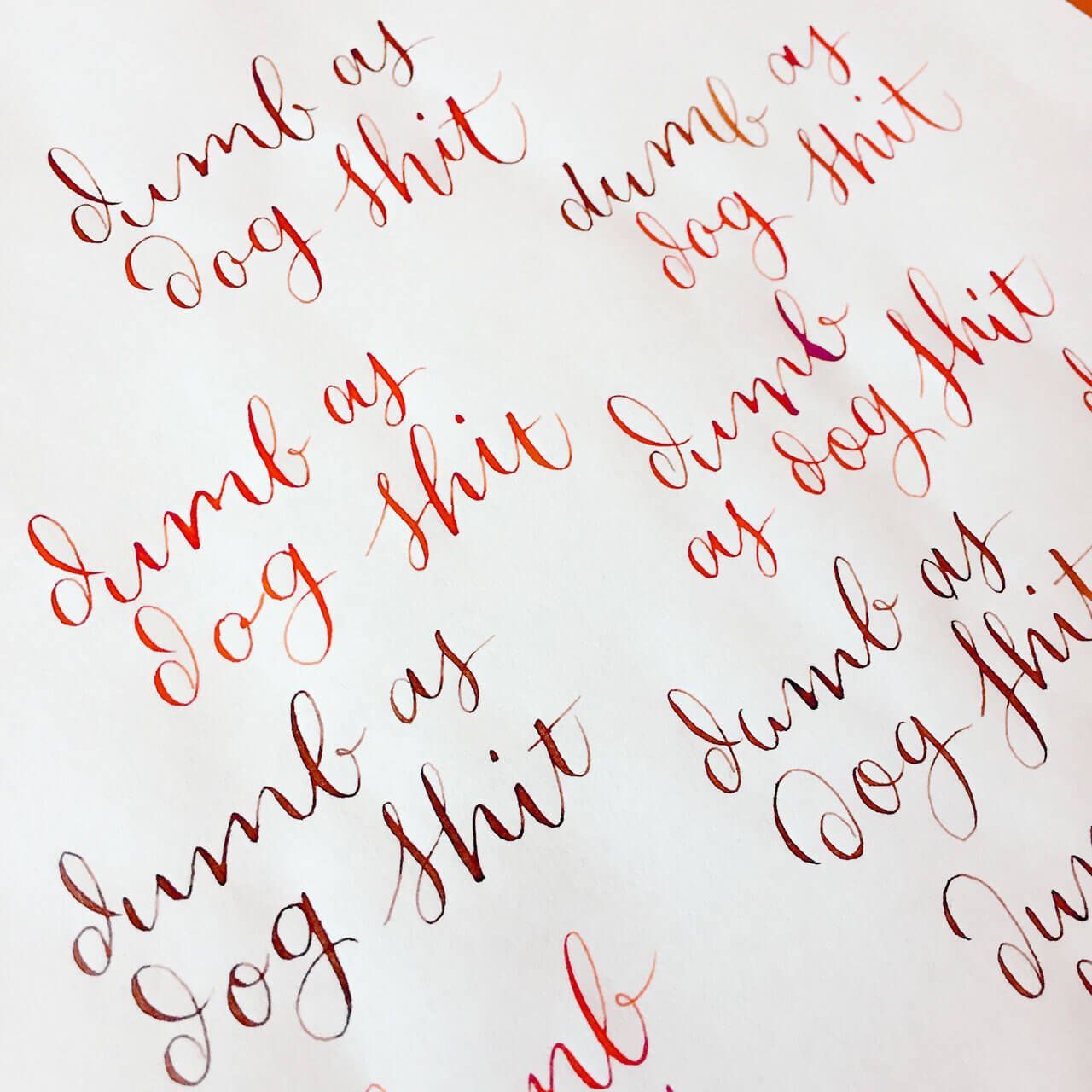 Handwritten calligraphy in reddish-brown ink repeats the phrase 