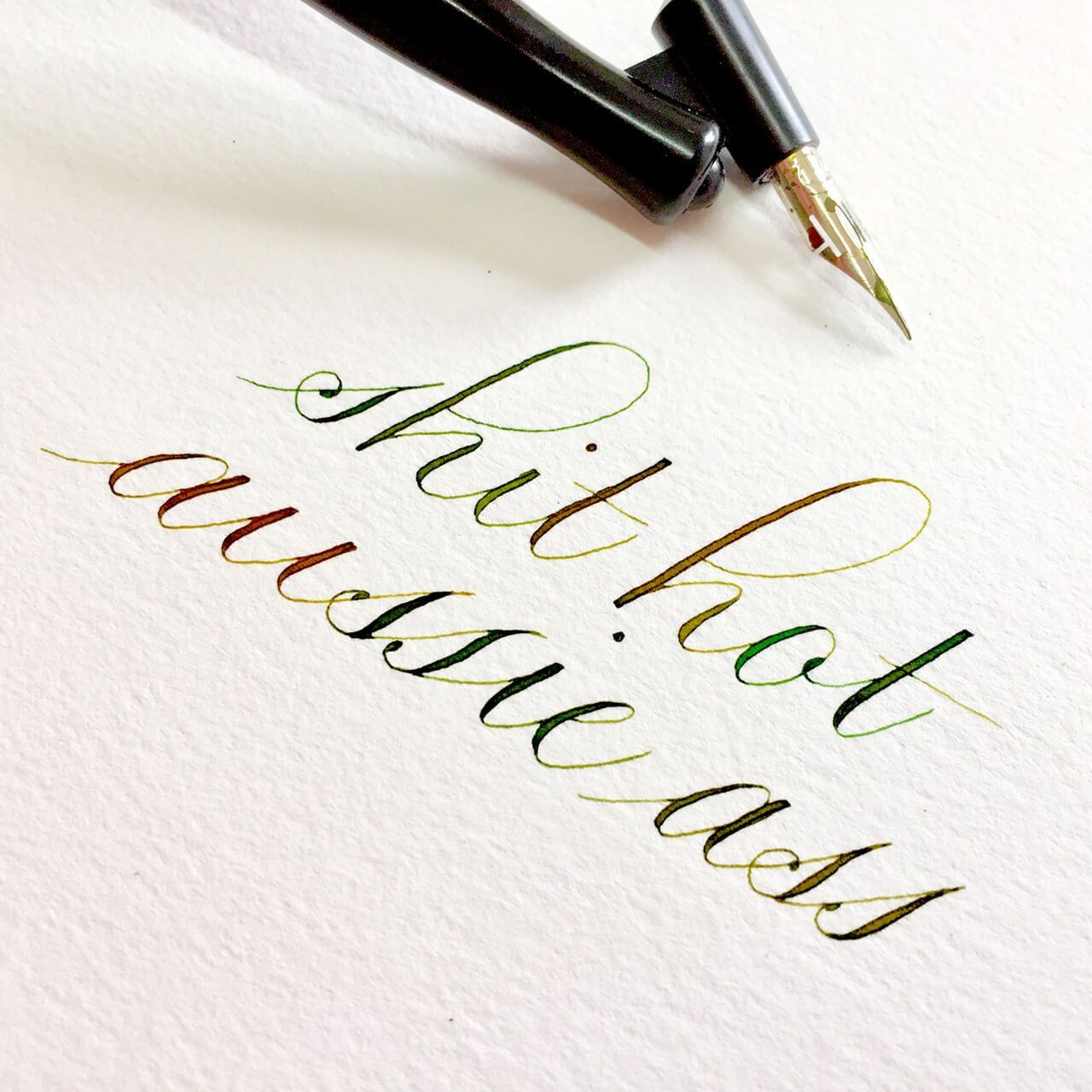 Elegant green calligraphy on white paper reads 