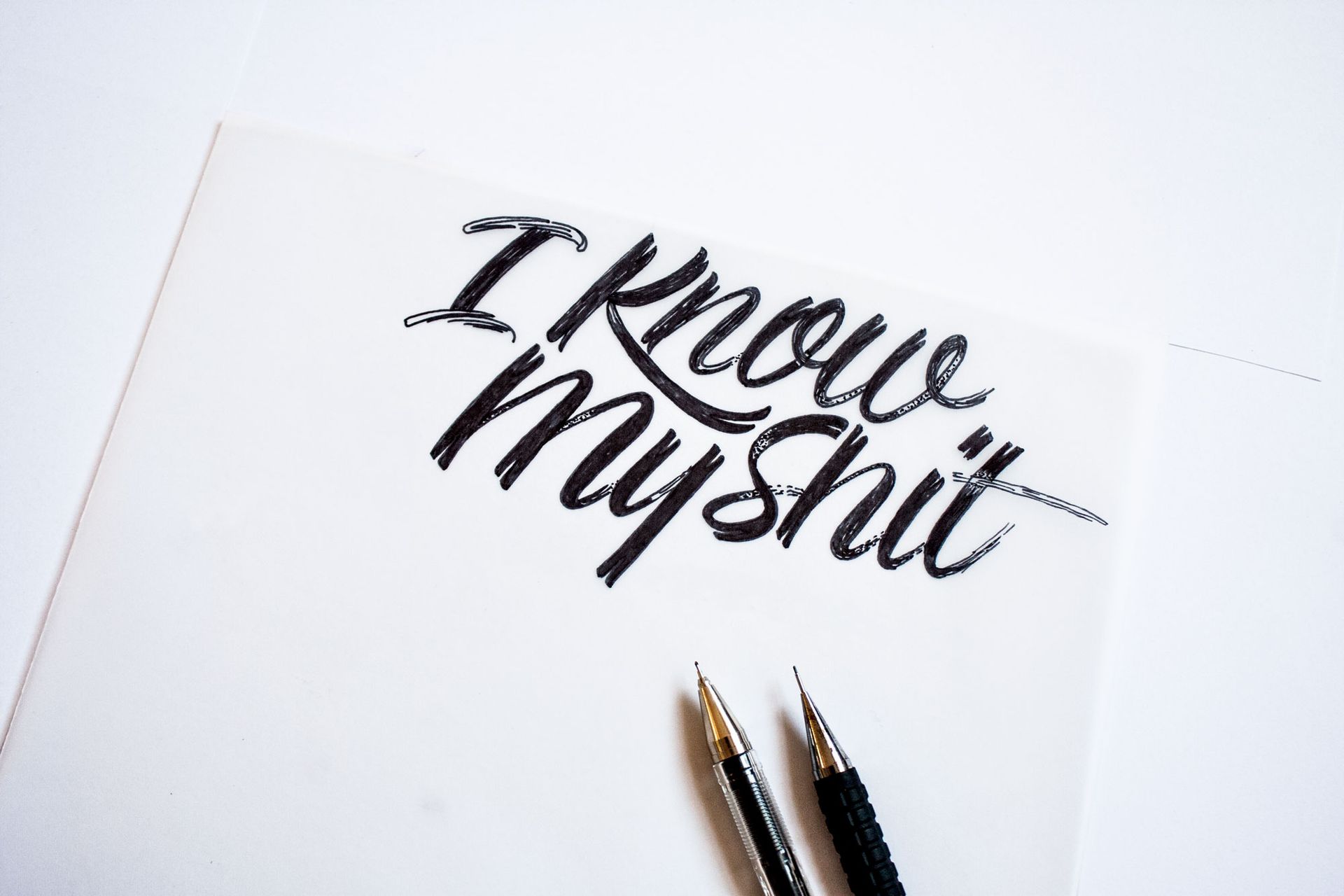 Black calligraphy on a white background that reads,