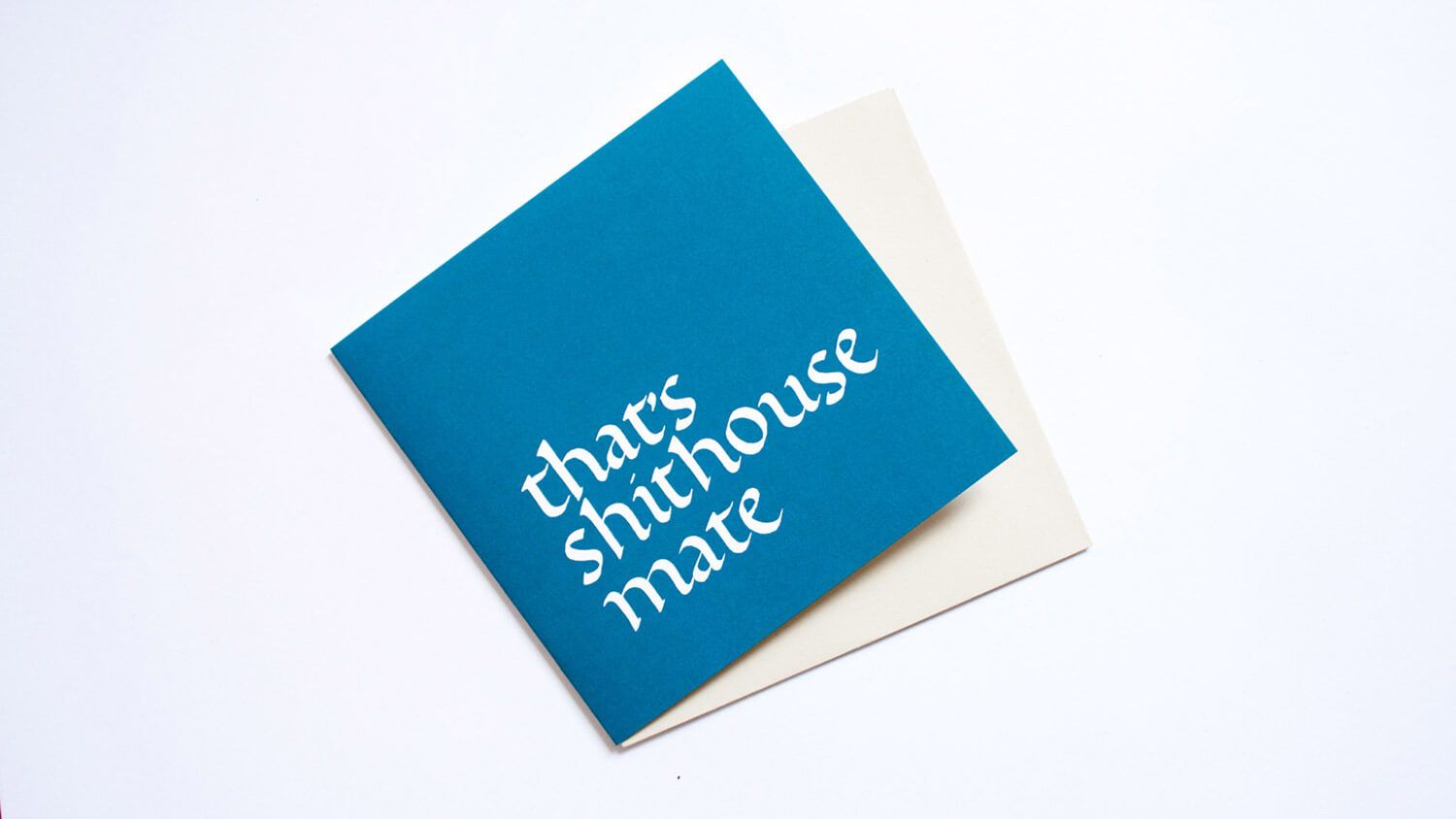 Blue square card with white text reading “that’s shithouse mate” on a light background