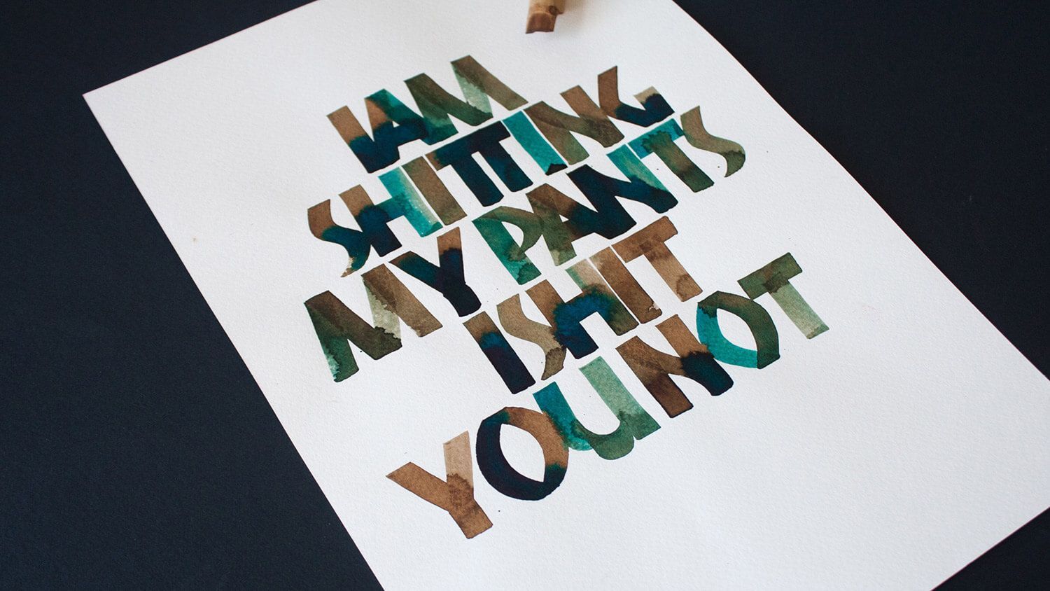 3D “Keep Listening” text in green and brown on a white sheet against a dark background