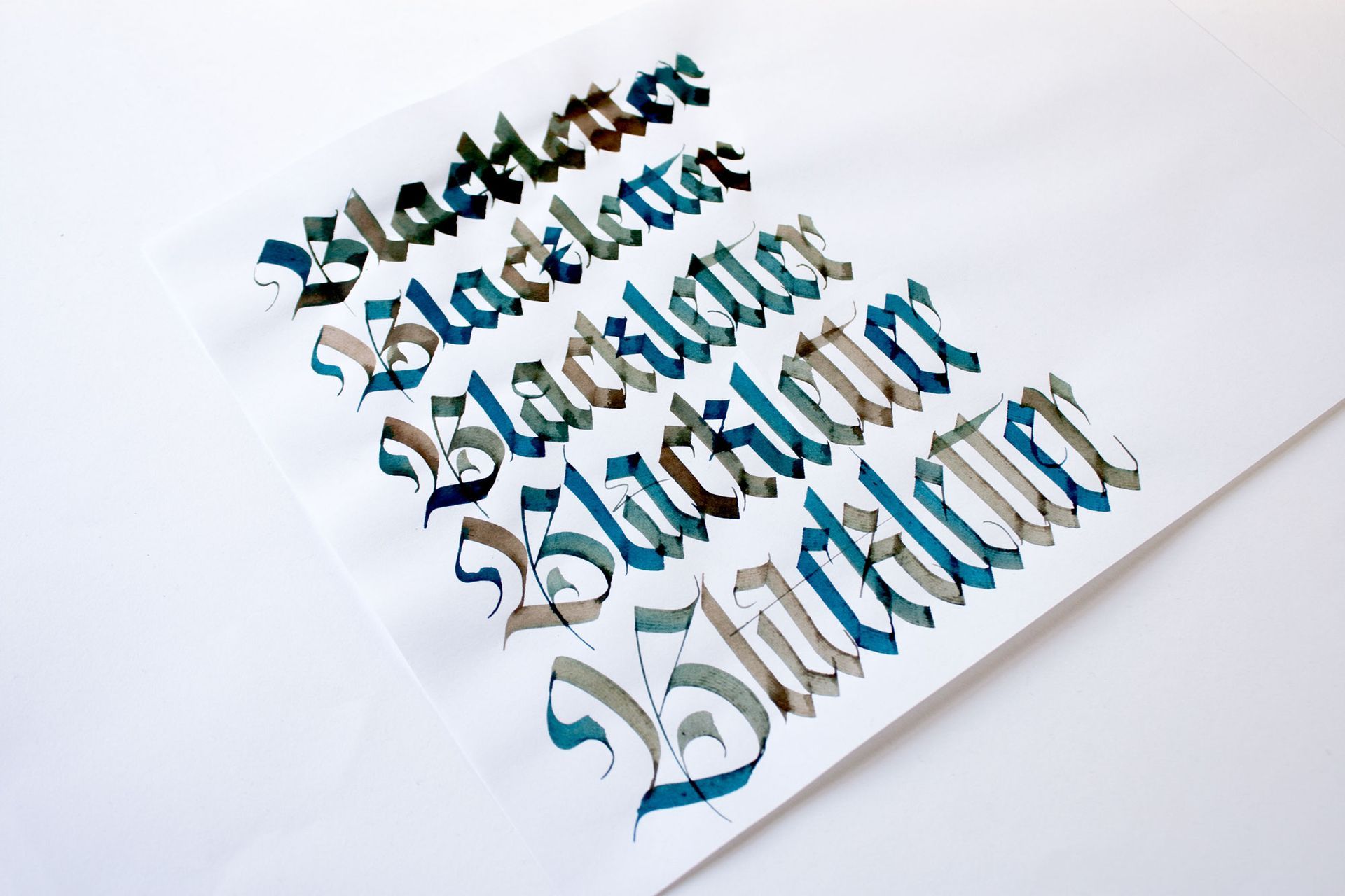 Stylized black-and-turquoise 3D Arabic calligraphy on a white background