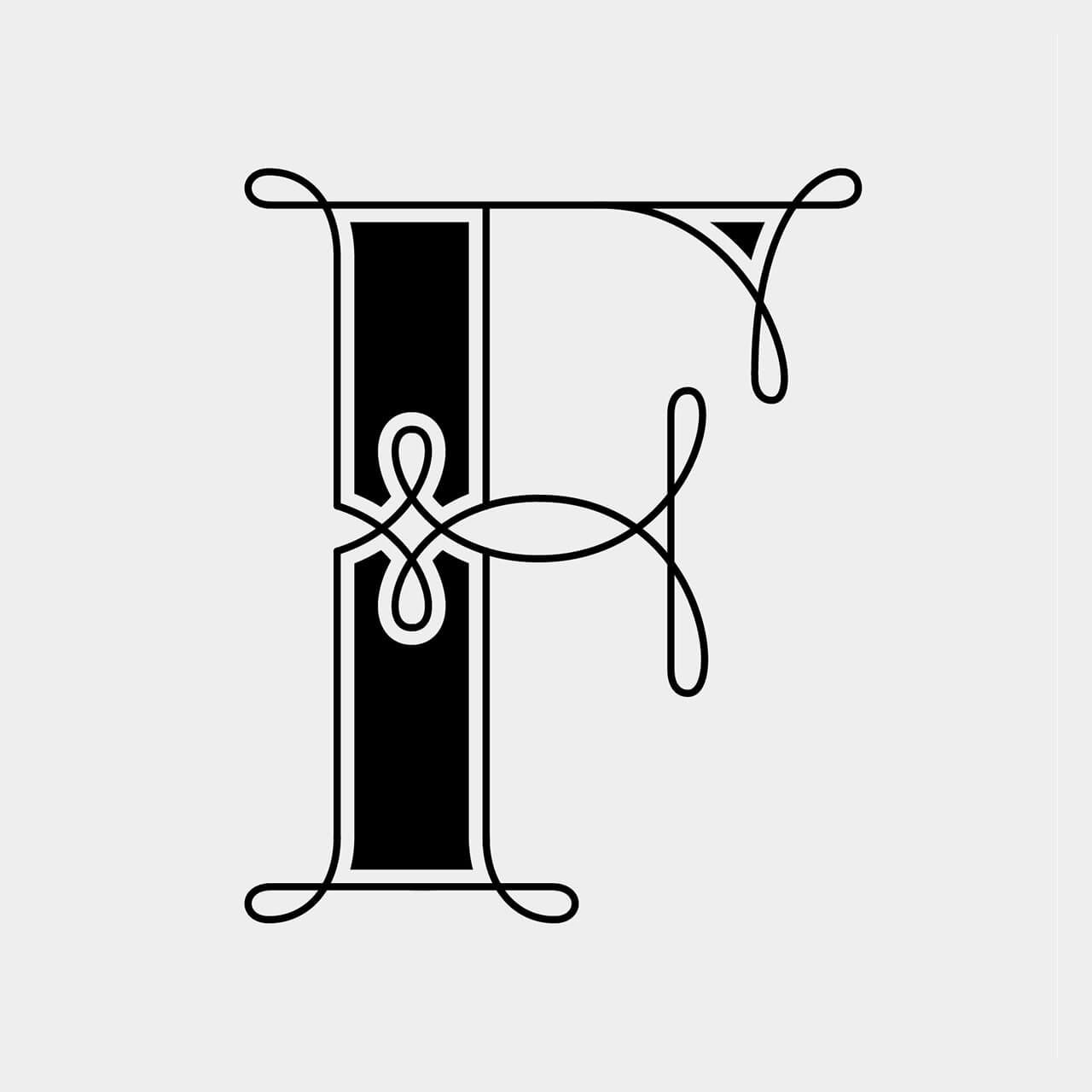 Green Fairy Font. Decorative black serif letter H with ornate flourishes on a light background