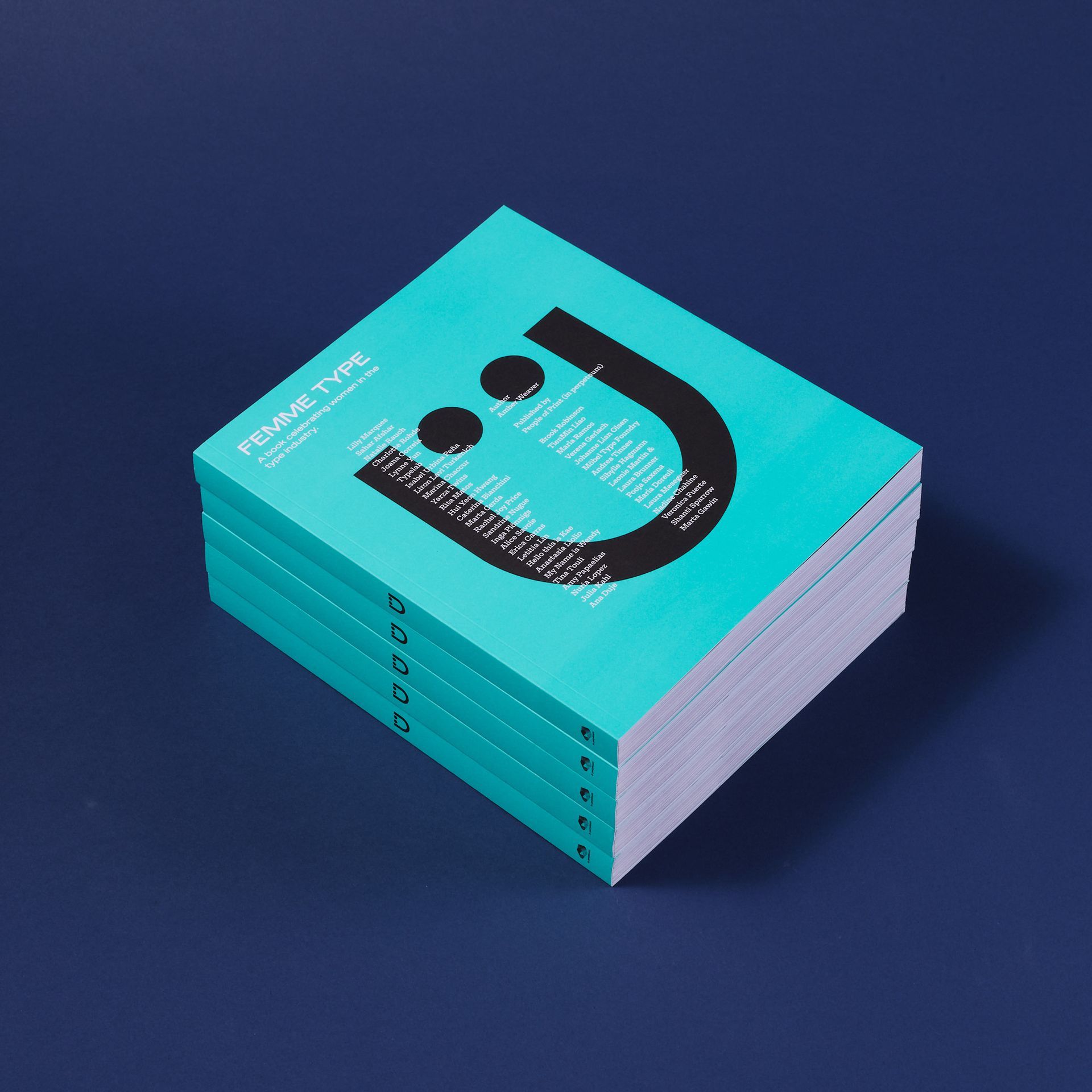 A stack of five teal books featuring a black, stylized