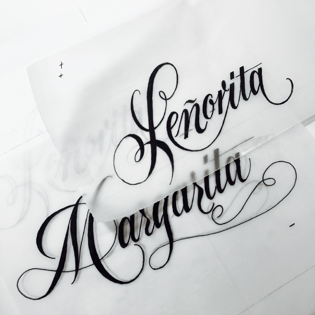 Black calligraphy reading “Señorita Marquita” on white paper.