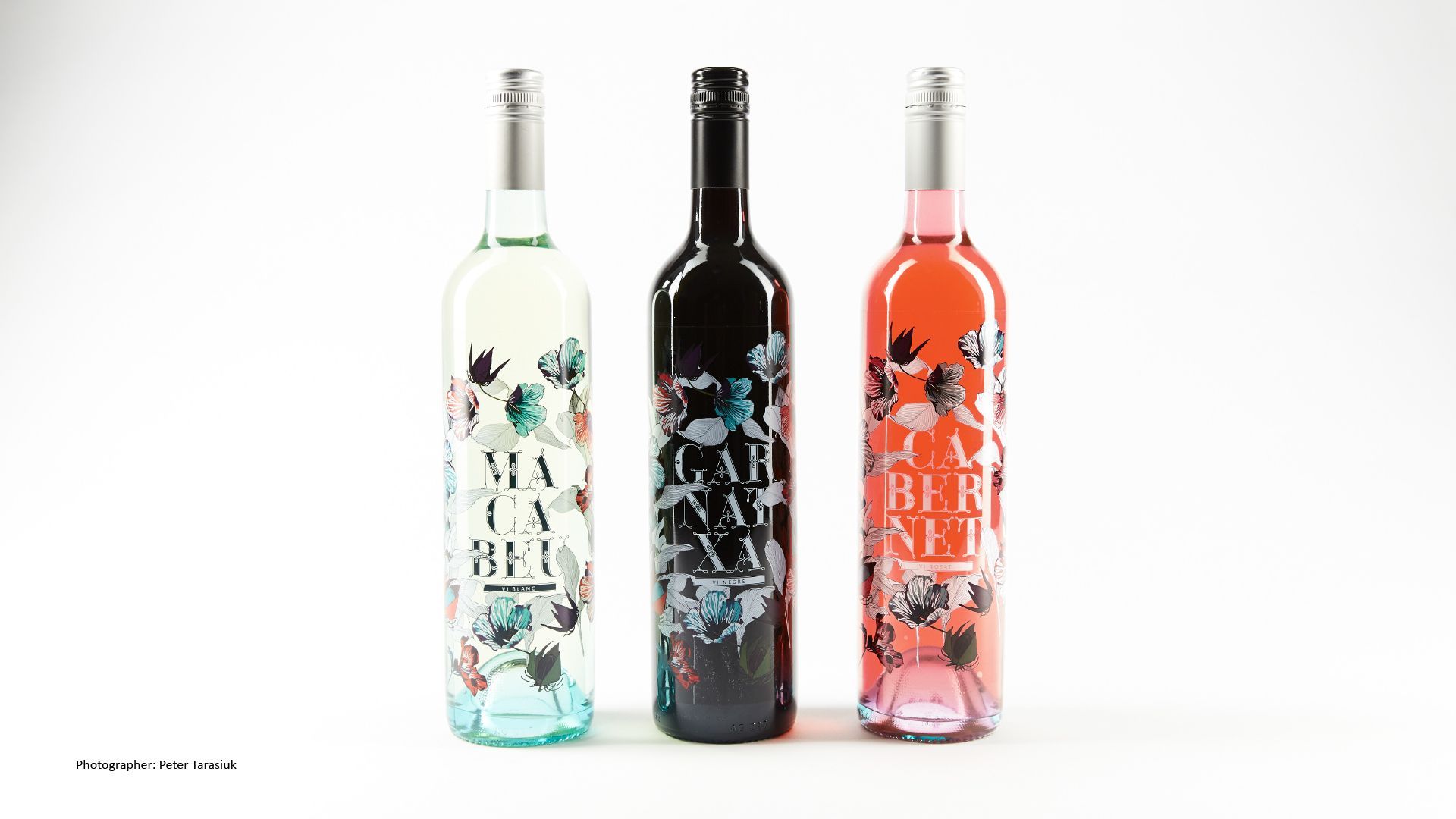 Green Fairy Font. Three decorative wine bottles in white, black, and coral on a white background.