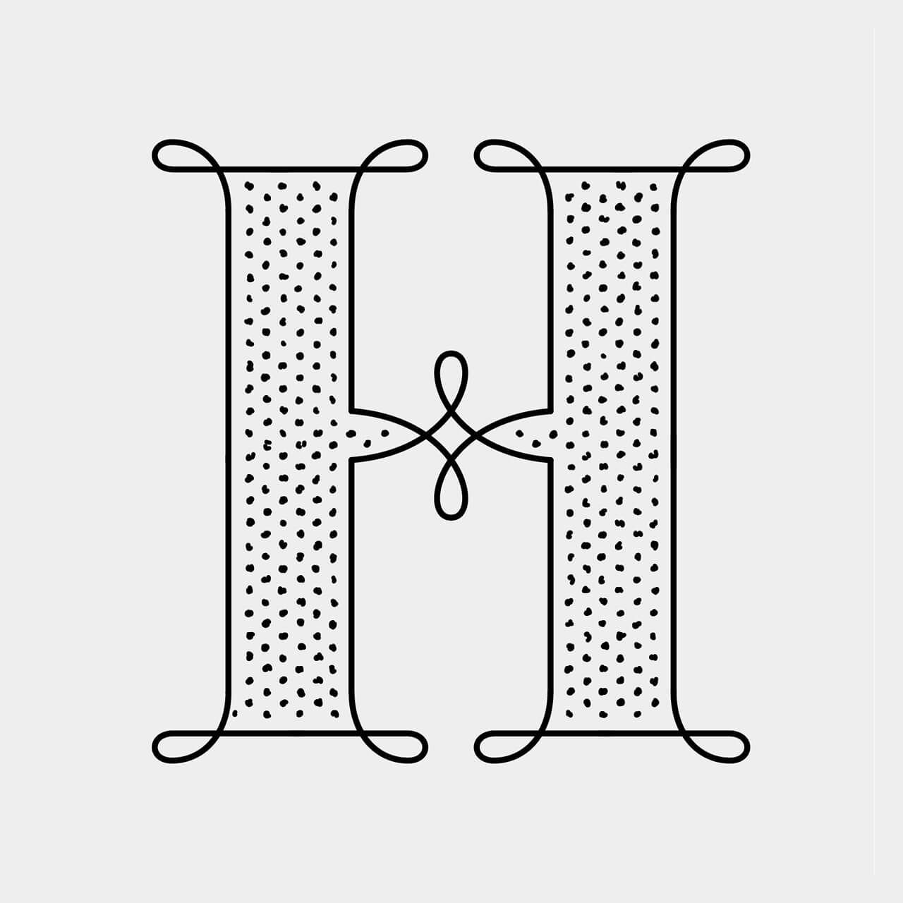Green Fairy Font. Decorative black serif H with dotted fill on a white background, linked by a small floral knot in the center