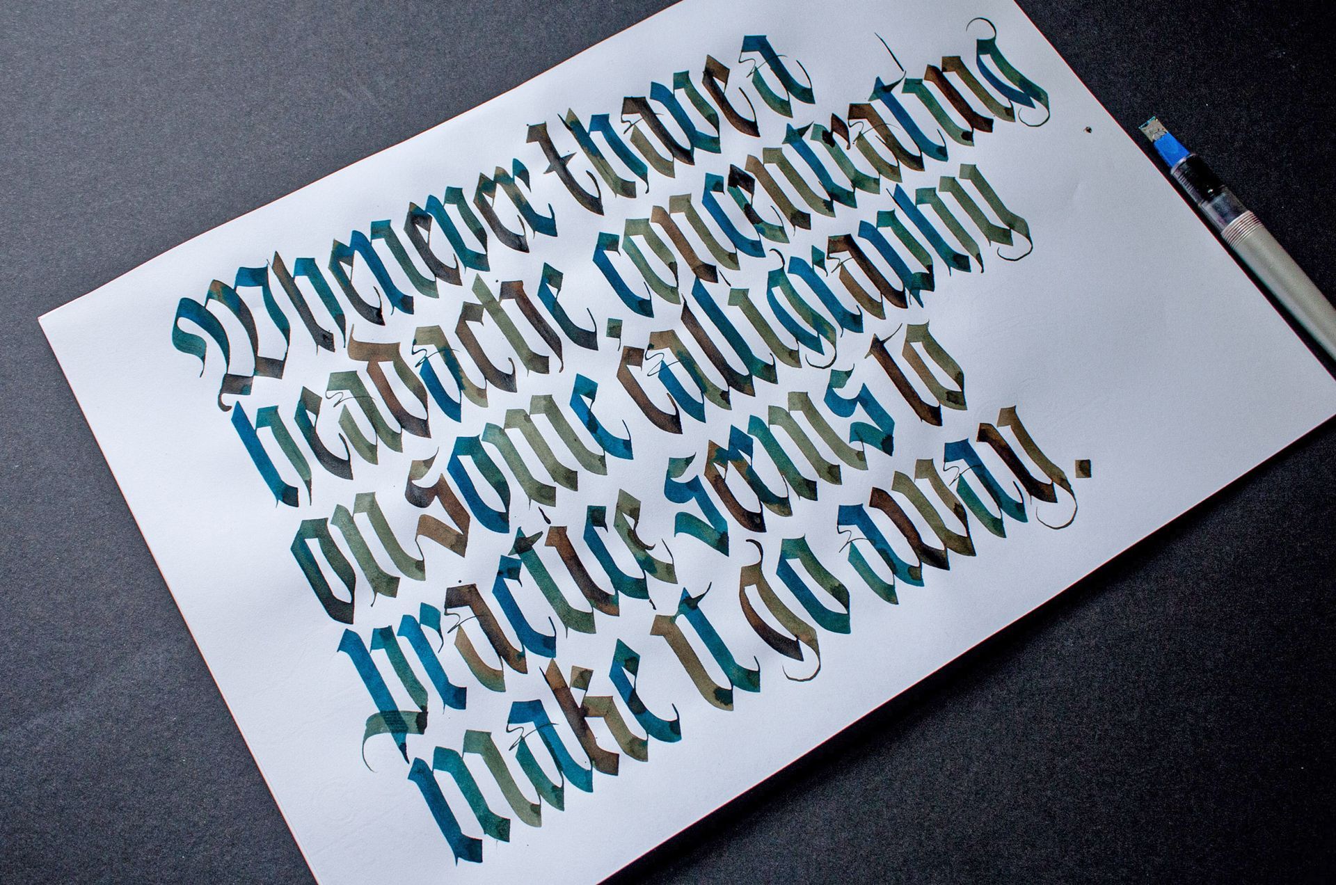 White card with blackletter text on a dark surface, shown at an angle.
