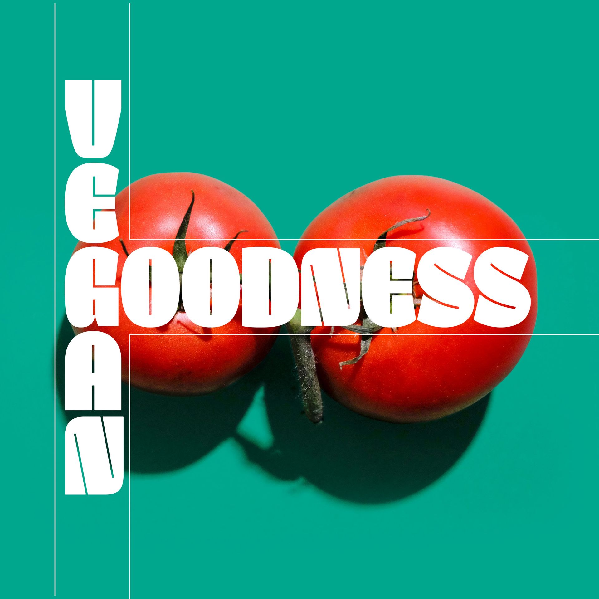 Vegan goodness text over two red tomatoes on a teal background