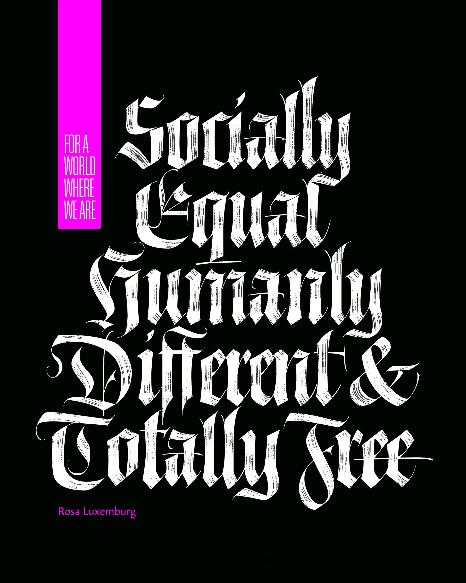 Black poster with gothic white text: “Socially Equal, Humanly Different & Totally Free.”