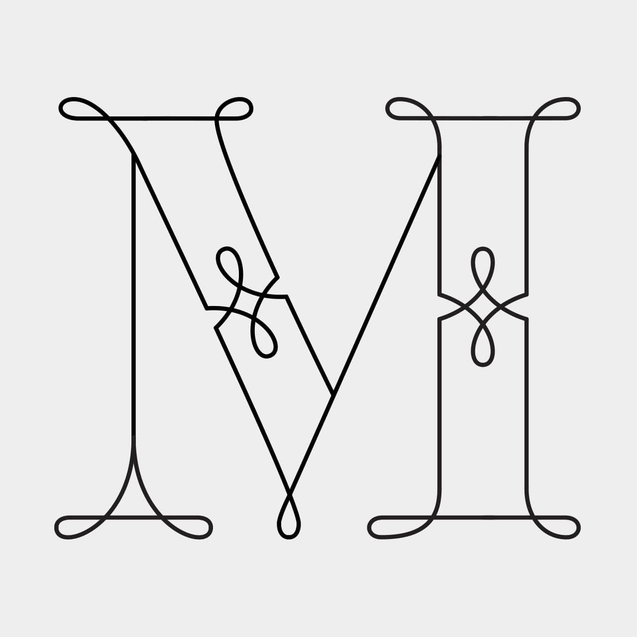 Green Fairy Font. Decorative black monogram letters N and M intertwined on a white background