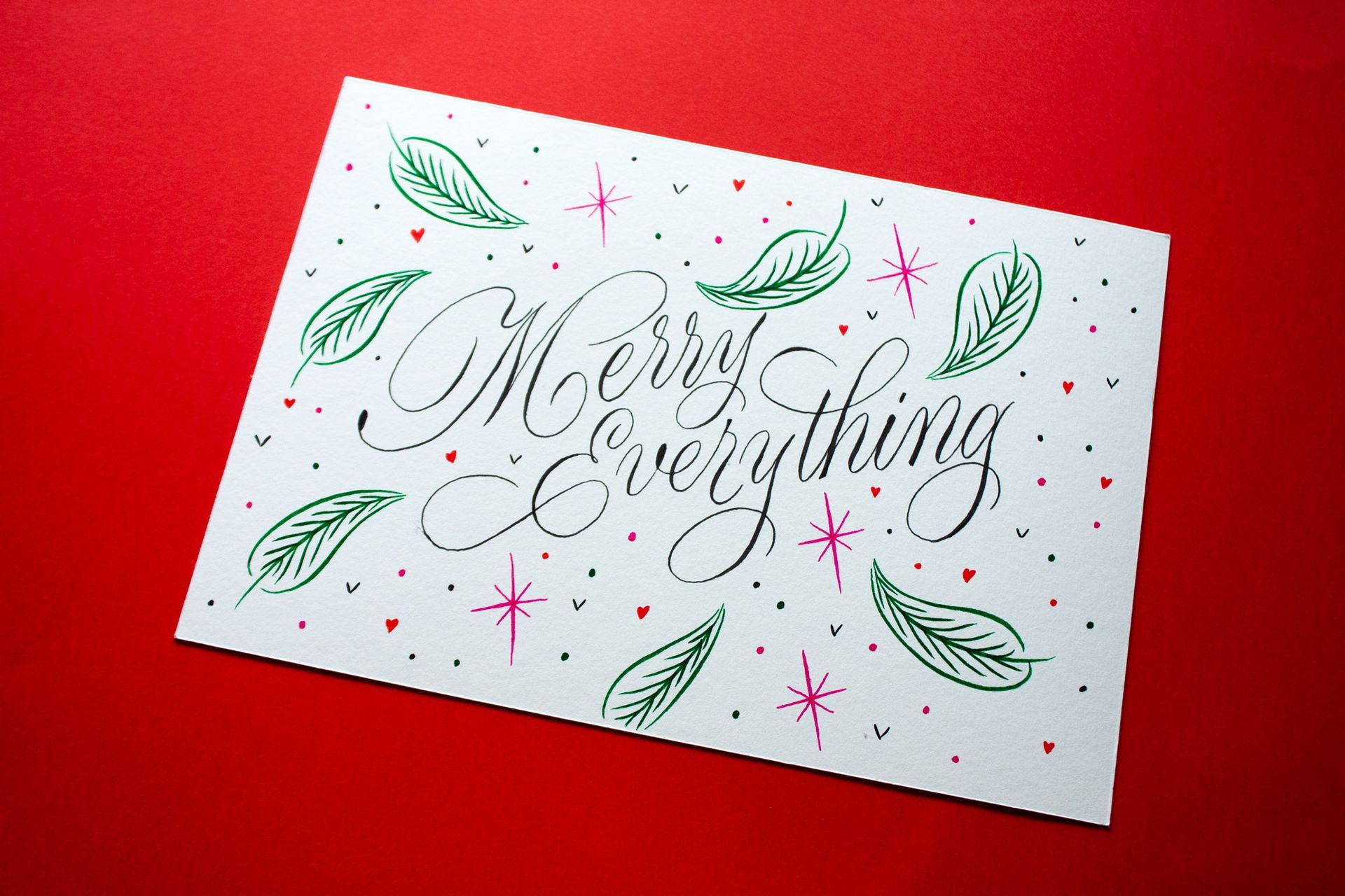 A card with the black calligraphy text