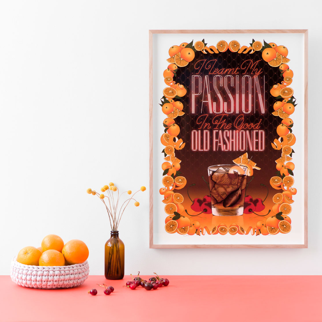 Halloween-themed poster on a white wall with pumpkins, flowers, and orange tabletop decor