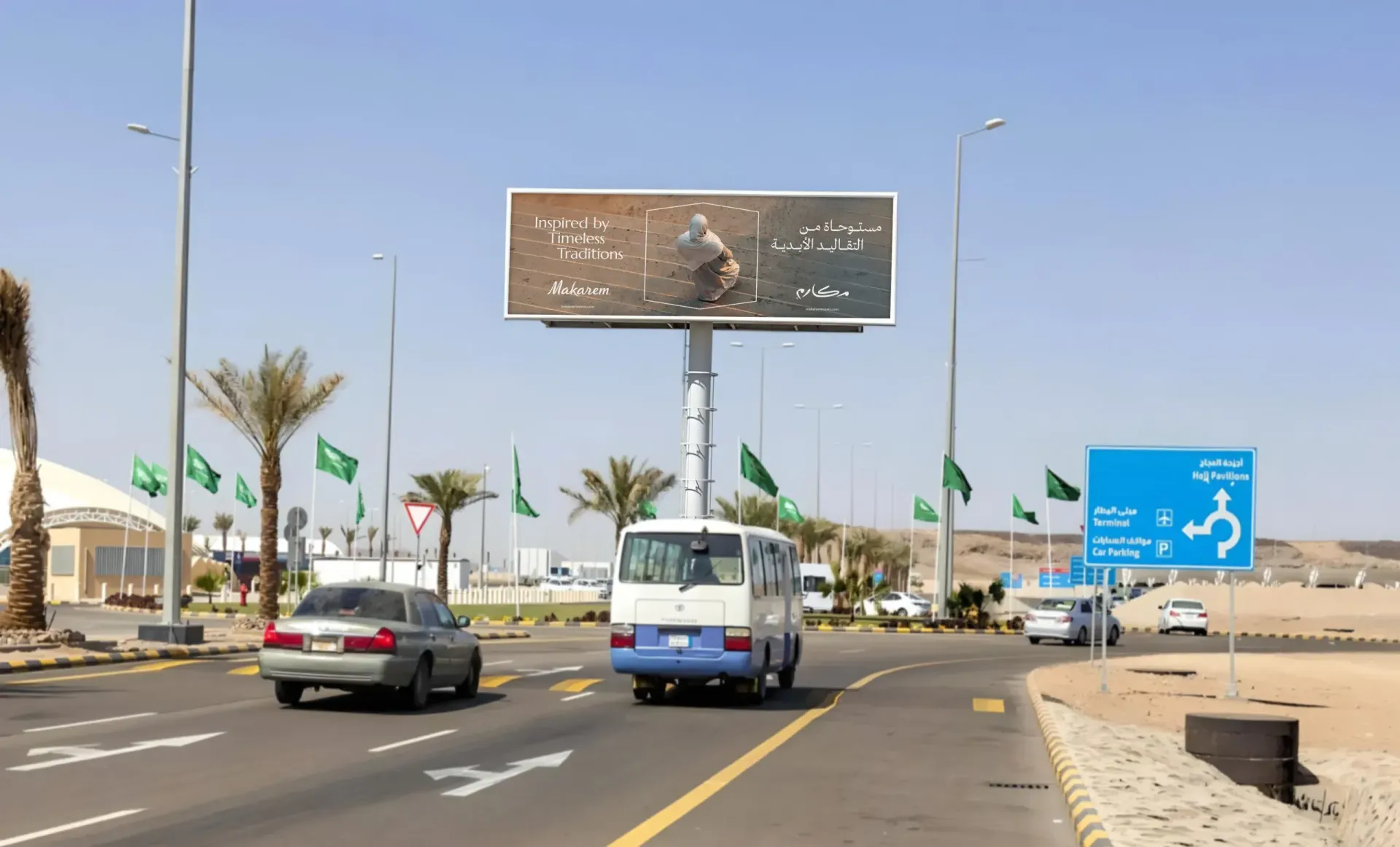 Desert highway with cars, a bus, palm trees, and large road signs under a clear sky.