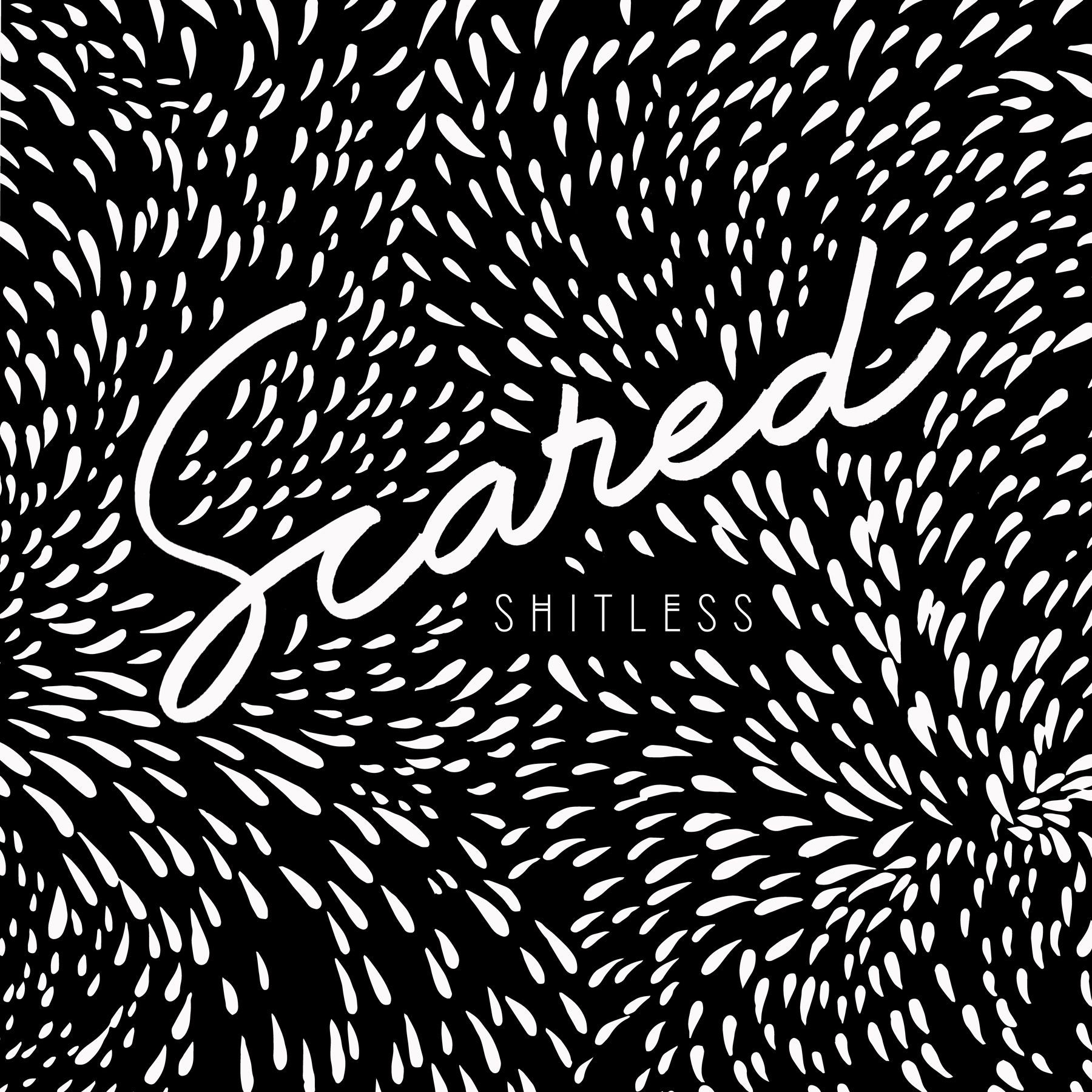 White “Scared” script with “SHITLESS” below on a black background with white leaf-like marks