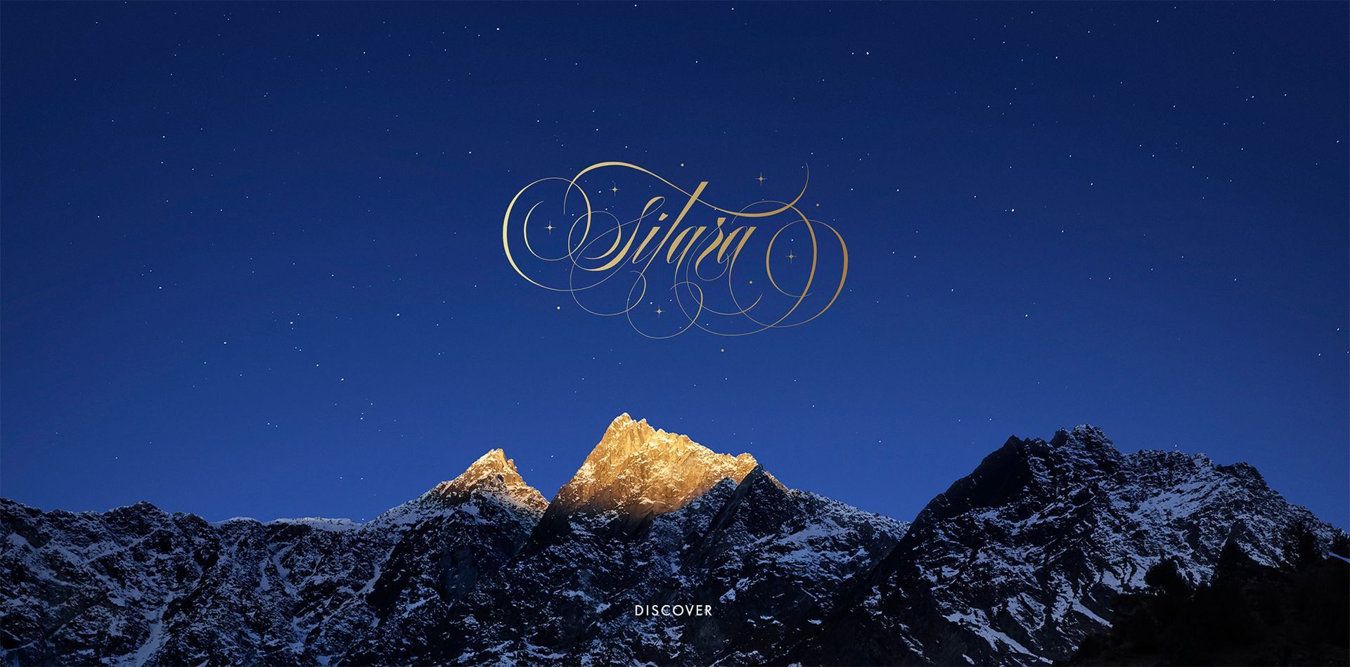 Snowy mountain peaks under a deep blue night sky with a glowing “Sifam” logo above