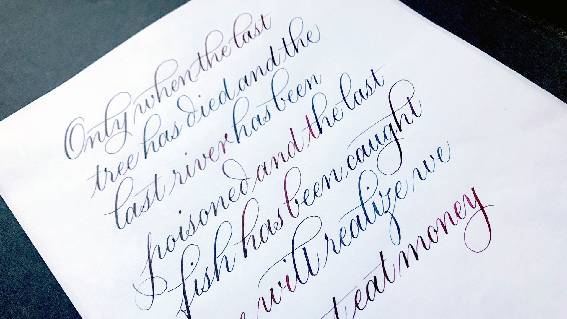 Calligraphy on white paper stating: