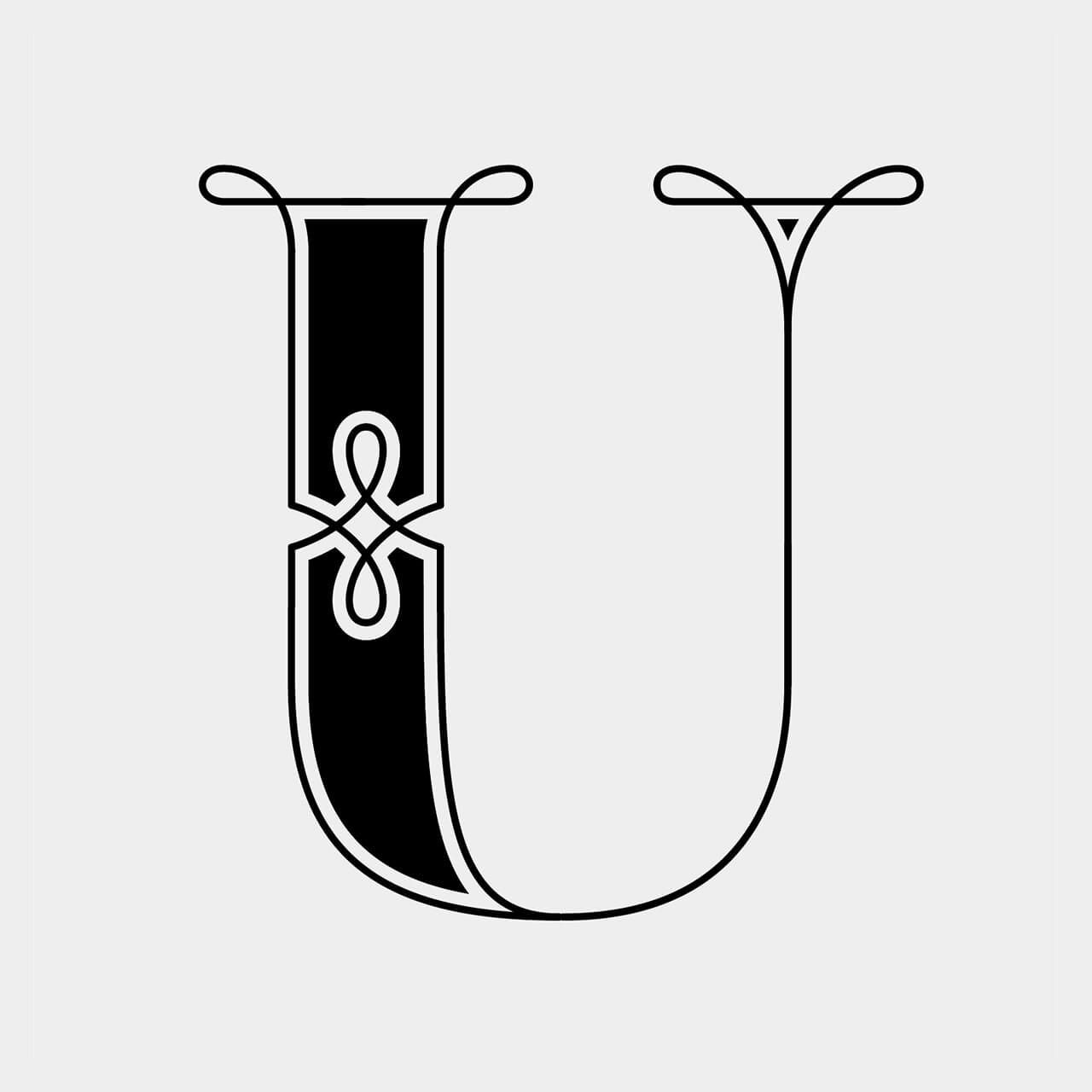 Green Fairy Font. Decorative black-and-white stylized letter U with ornate serif flourishes