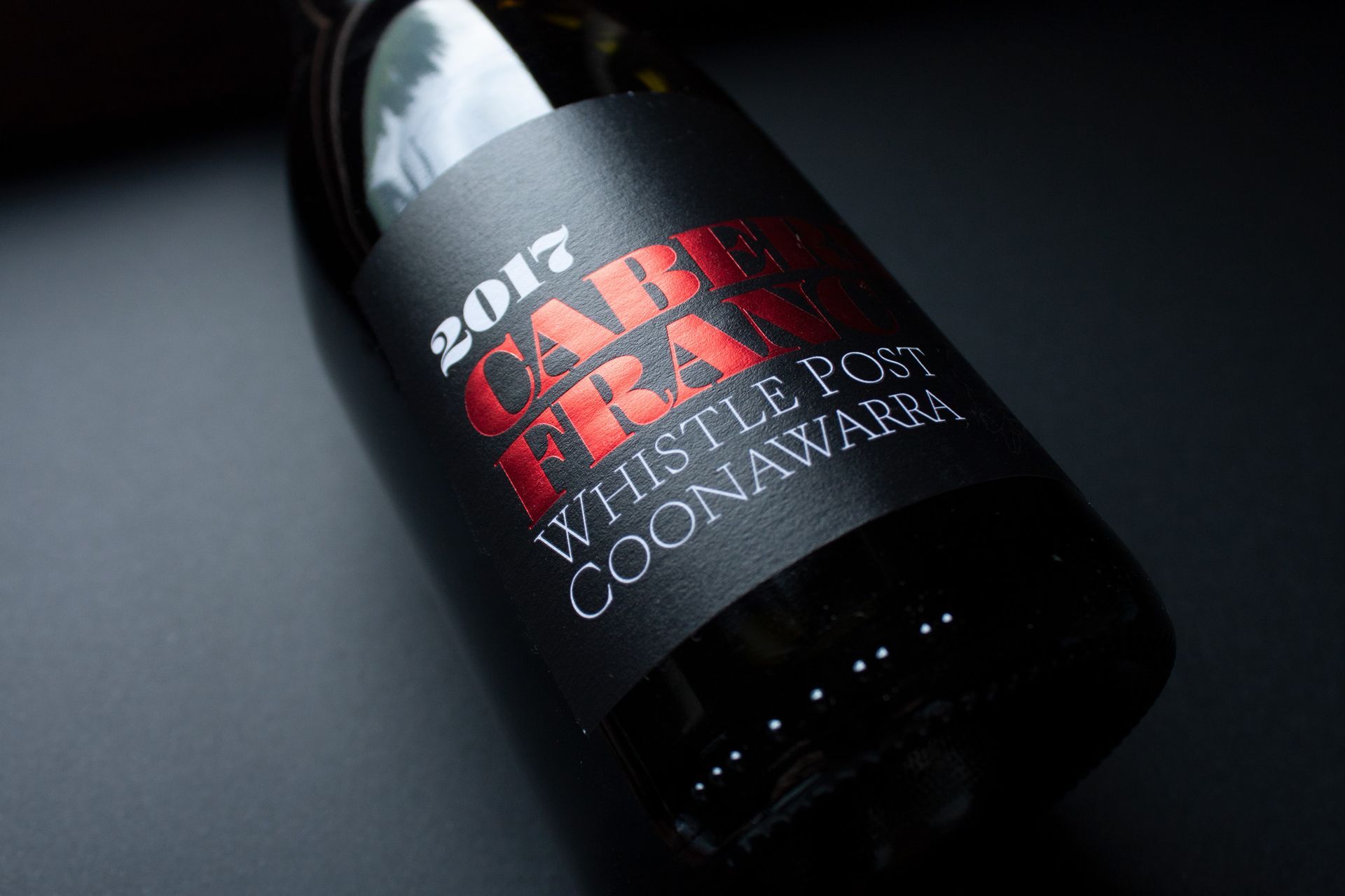 Bottle of 2007 Robert Craig Cabernet Sauvignon on a dark surface, label visible at an angle