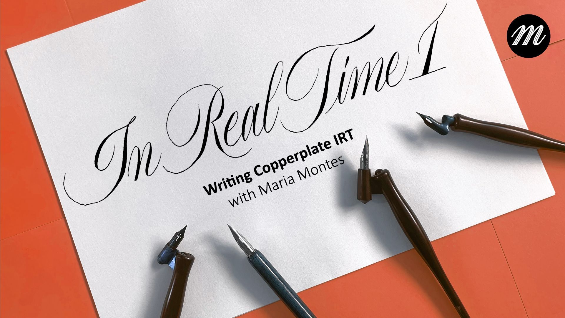 White paper on orange desk with pens and cursive calligraphy reading “In Real Time.”