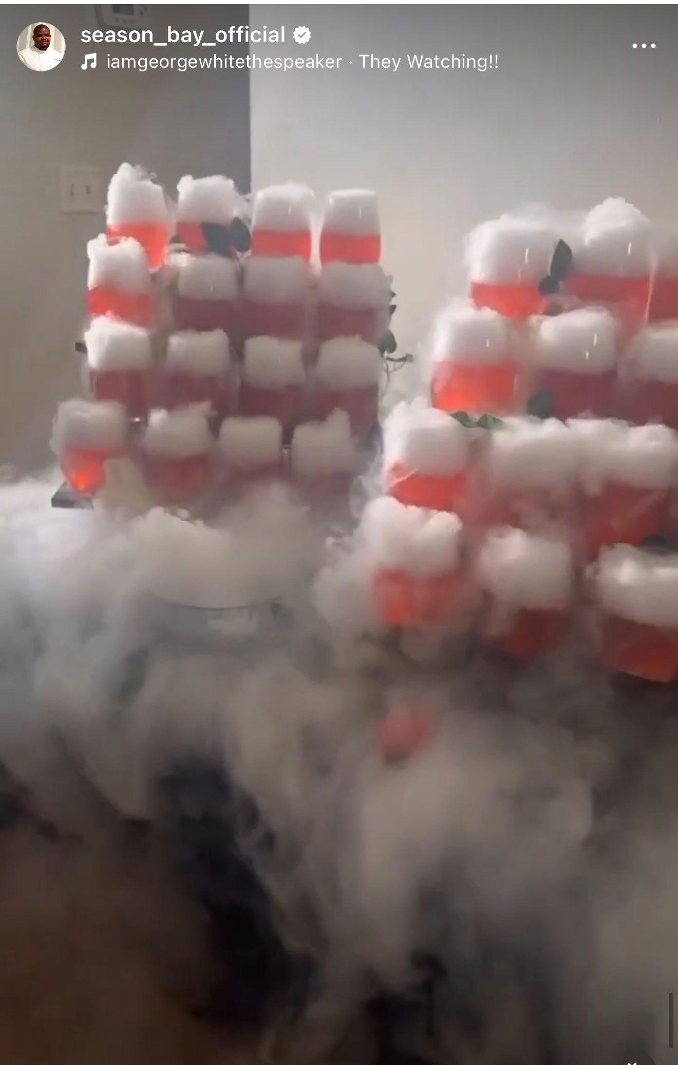 Two stacks of red and white shots on a misty surface, possibly a table.