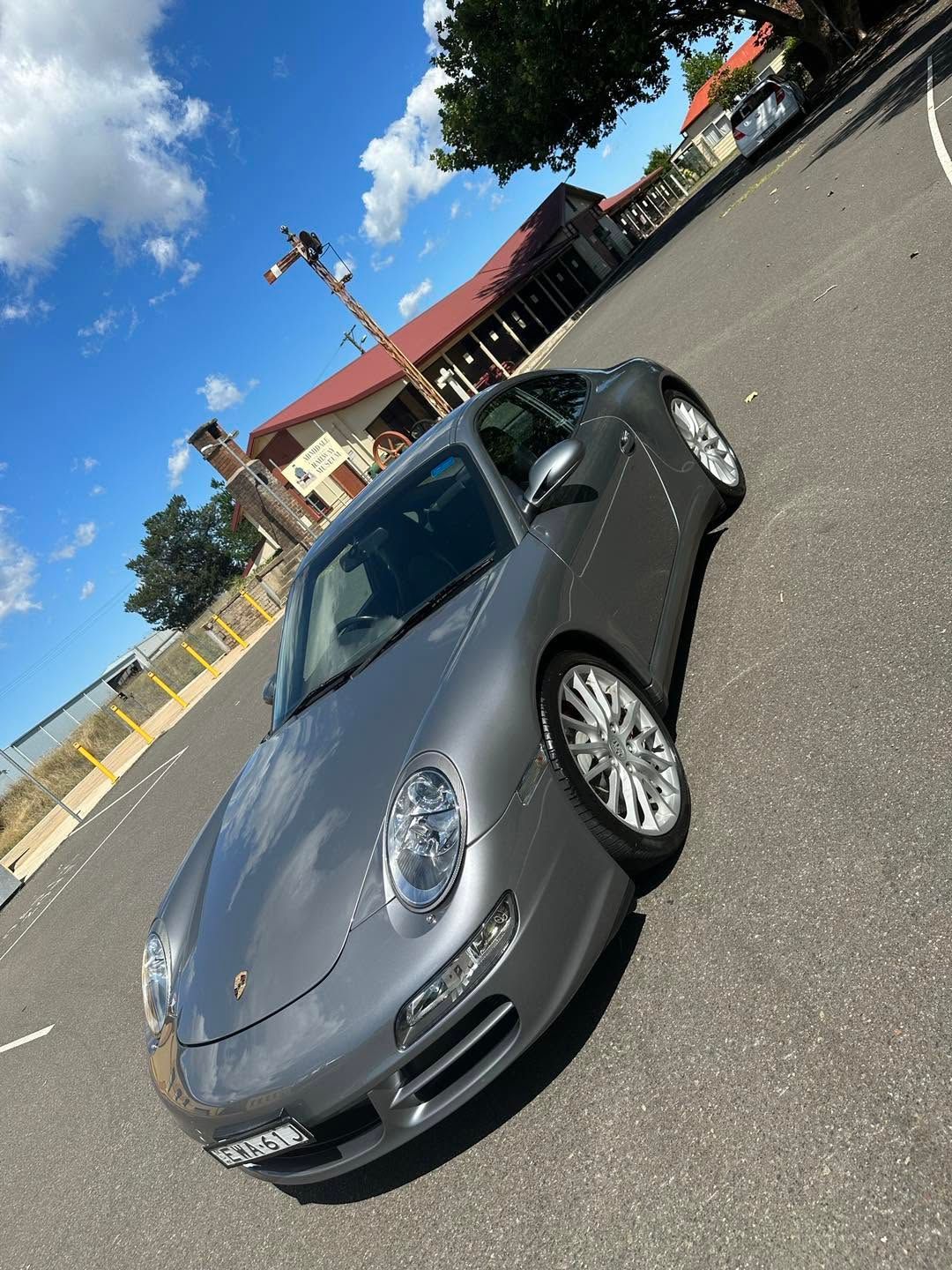 Gray Porsche 911 Parked on A Sunny Street  — Diamond Glow Auto Detailing in Armidale, NSW