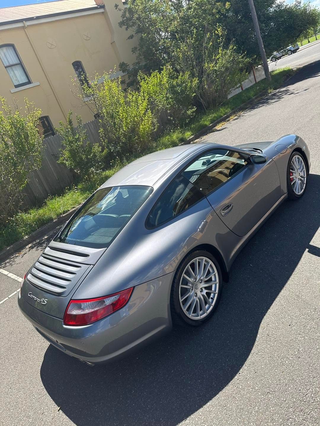 Silver Sports Car Parked on A Sunny Street Beside a Beige Building and Trees — Diamond Glow Auto Detailing in Armidale, NSW