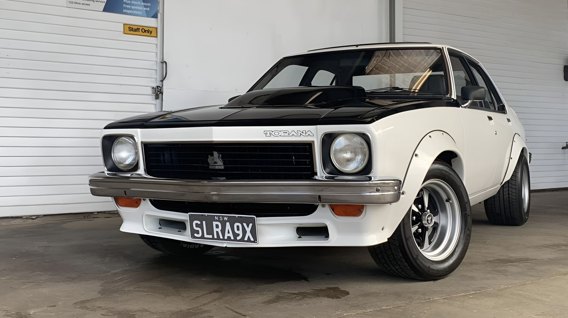 Classic White and Black Vintage Coupe Parked Indoors — Diamond Glow Auto Detailing in Armidale, NSW