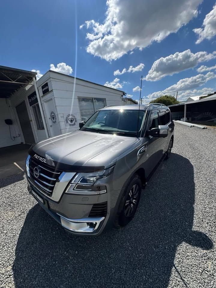 Silver SUV Parked on Gravel Beside a White Building — Diamond Glow Auto Detailing in Armidale, NSW