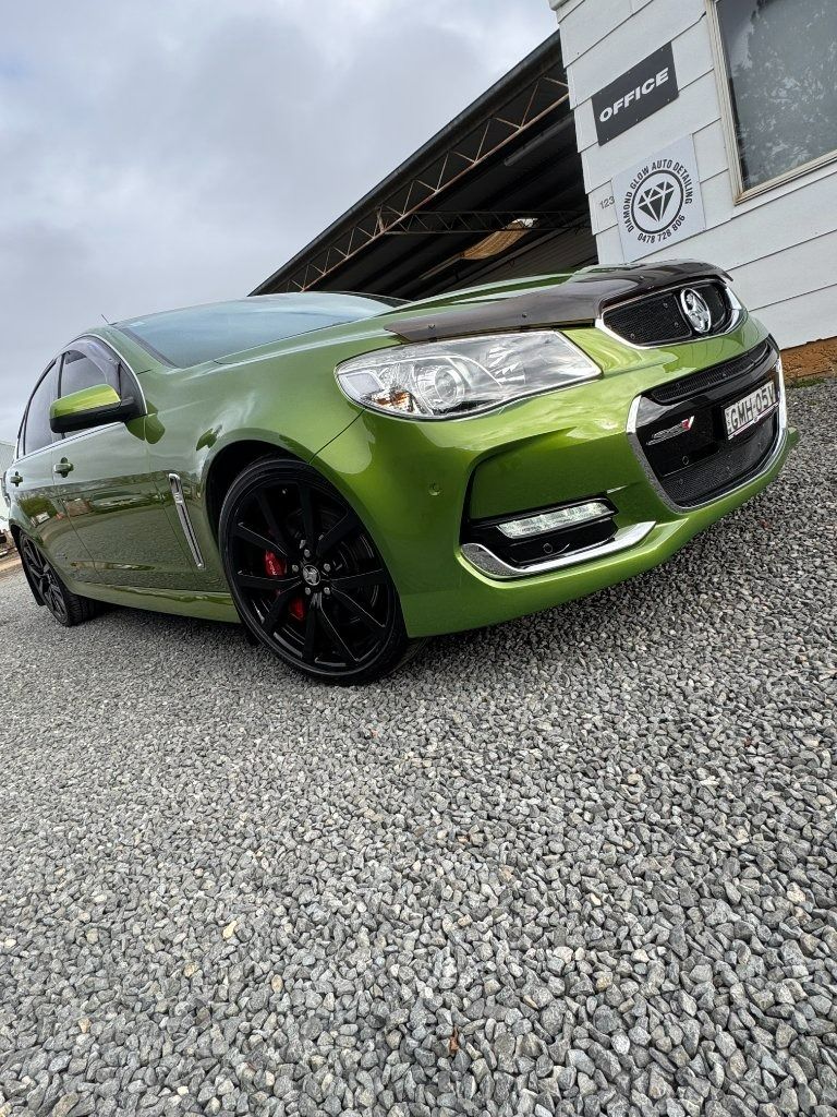 Green Sports Sedan Parked on Gravel Outside a Building — Diamond Glow Auto Detailing in Armidale, NSW