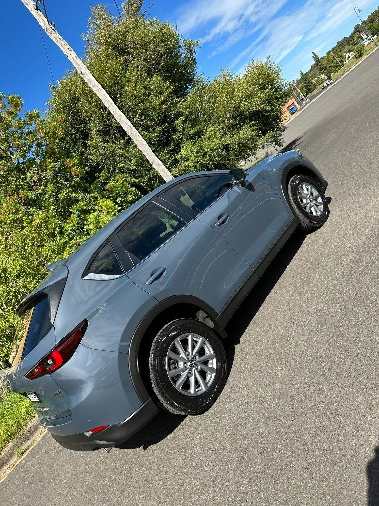 Gray Sedan Parked on A Road Beside Trees and A Utility Pole — Diamond Glow Auto Detailing in Armidale, NSW