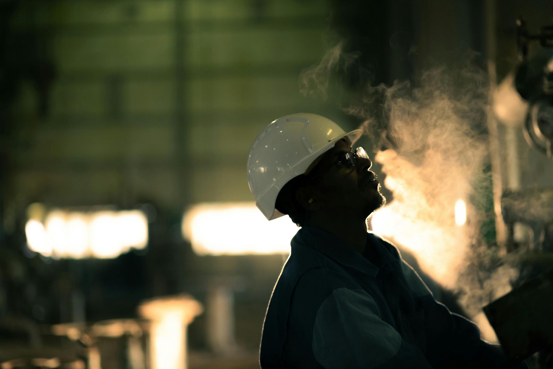 Professional boiler maintenance technician conducting combustion system inspection