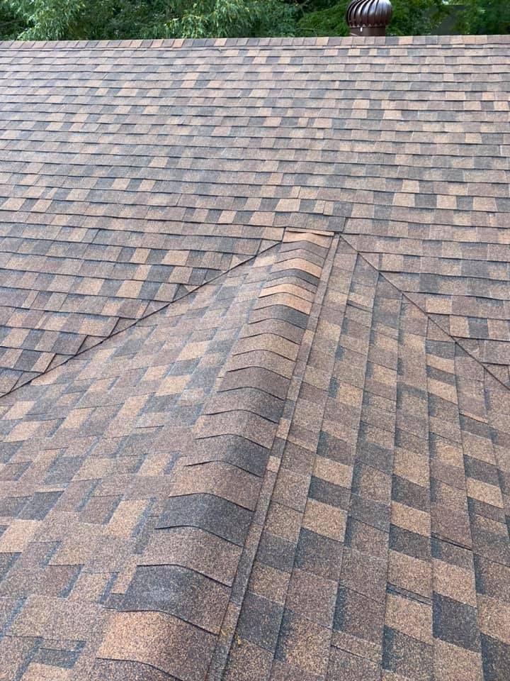 A close up of a roof with shingles on it.