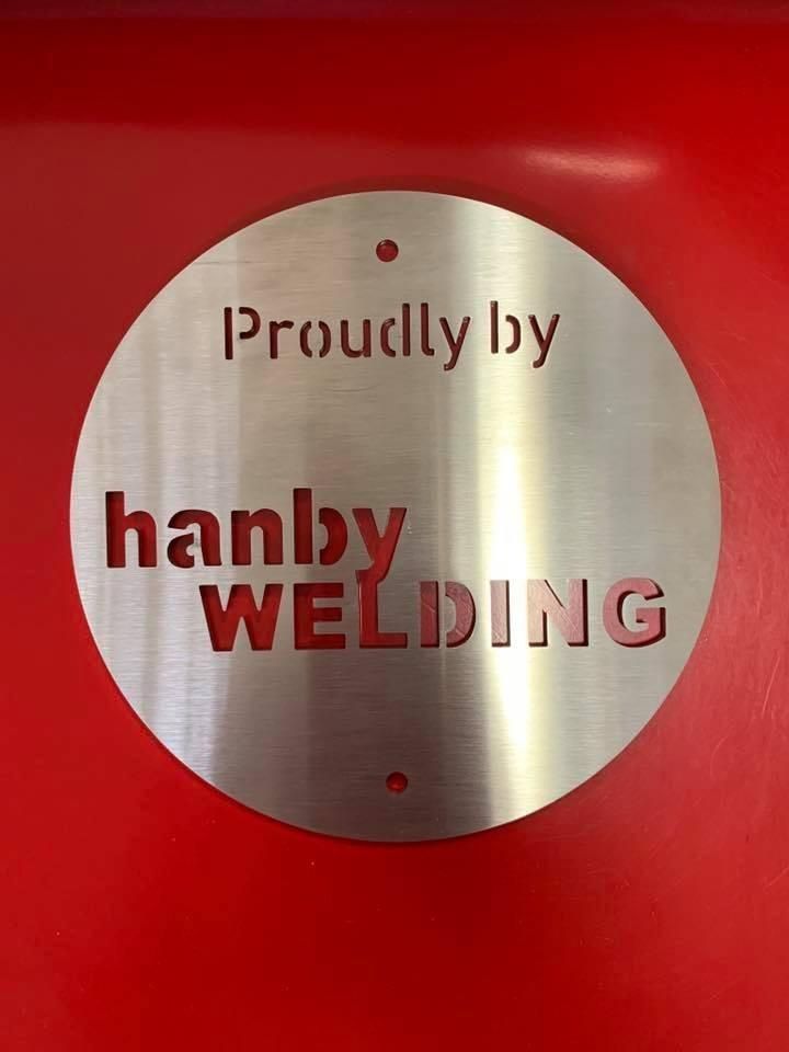 A Sign That Says Proudly By Hanby Welding — Hanby Welding & Engineering In Portsmith, QLD