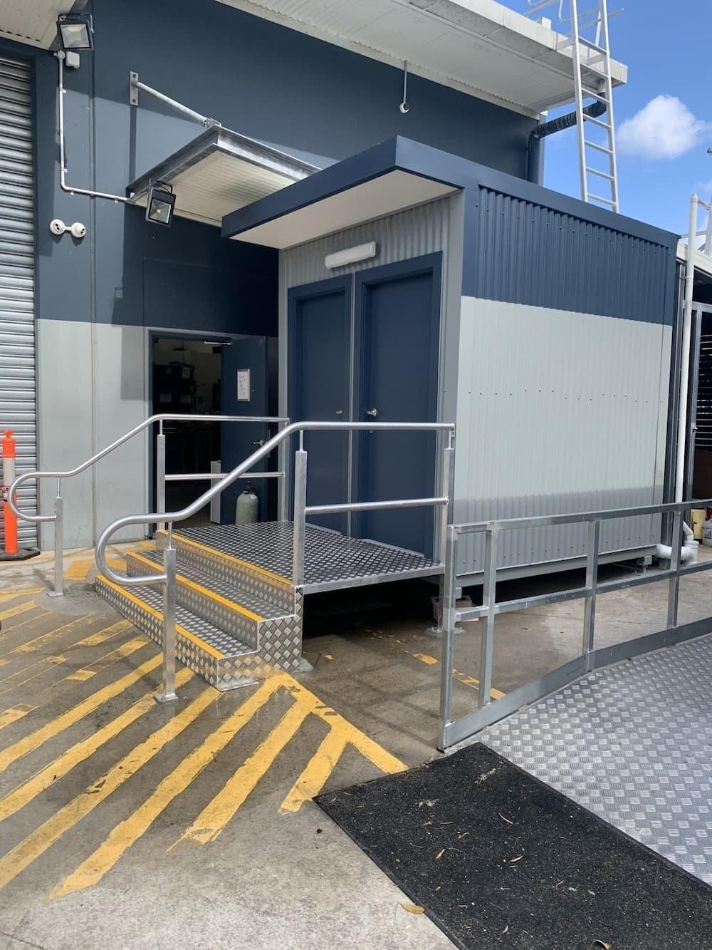 A Building With A Ramp And Stairs Leading To It — Hanby Welding & Engineering In Portsmith, QLD