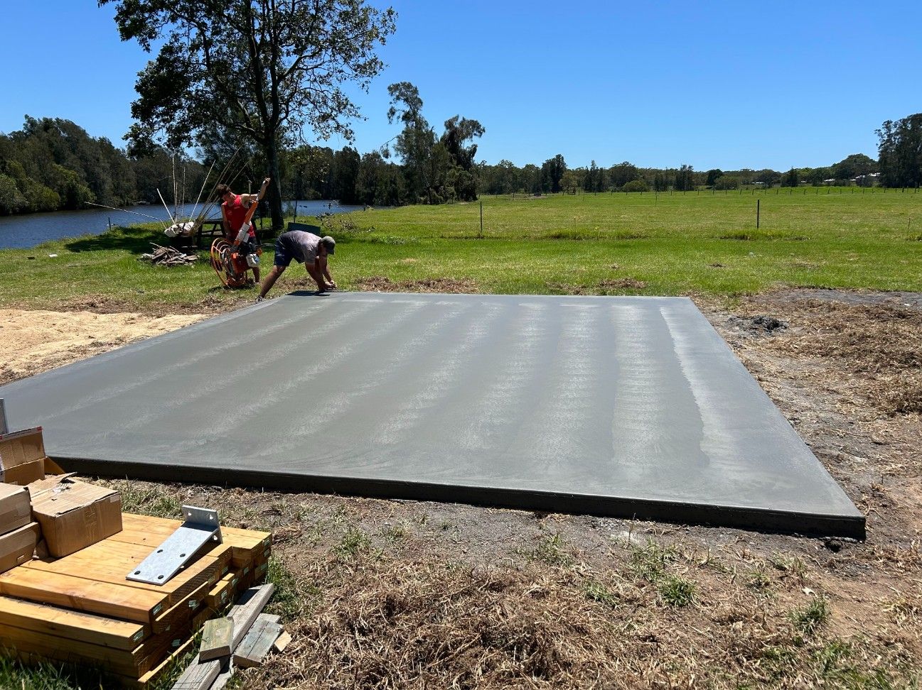 A Construction Site With Stacked Concrete Blocks — J’s Concreting & Carpentry in Kew, NSW