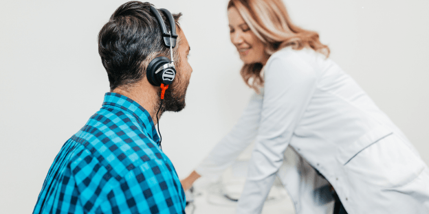man receiving a hearing evaluation