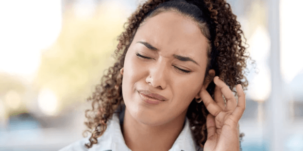 woman experiencing tinnitus