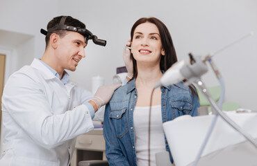 woman receiving hearing exam