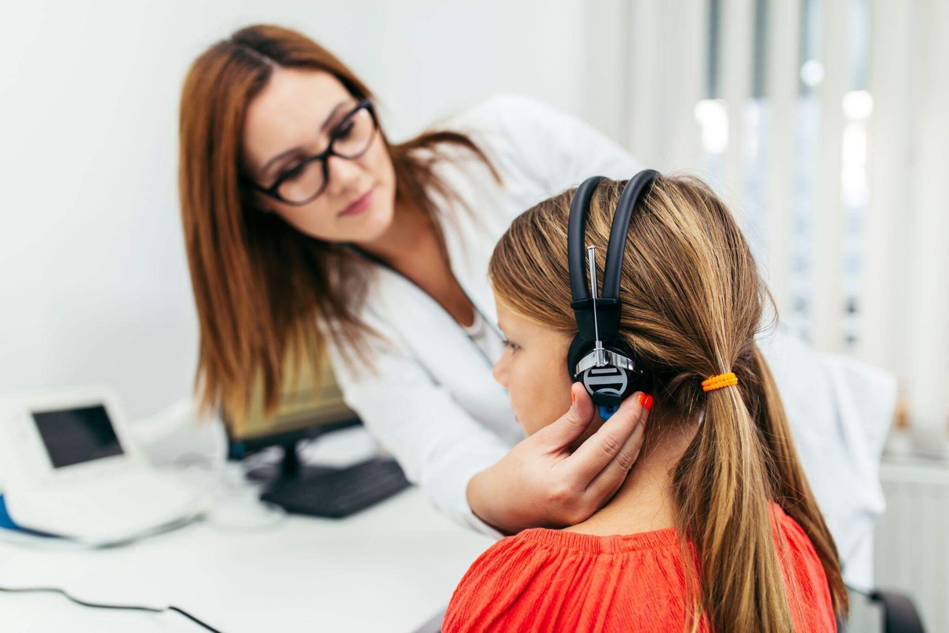 child receiving hearing evaluation