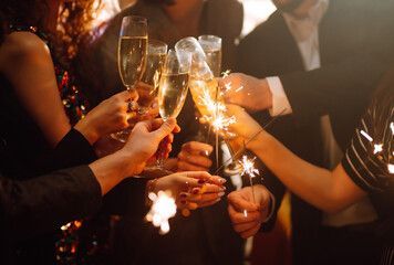 people toasting with champagne at a holiday gathering