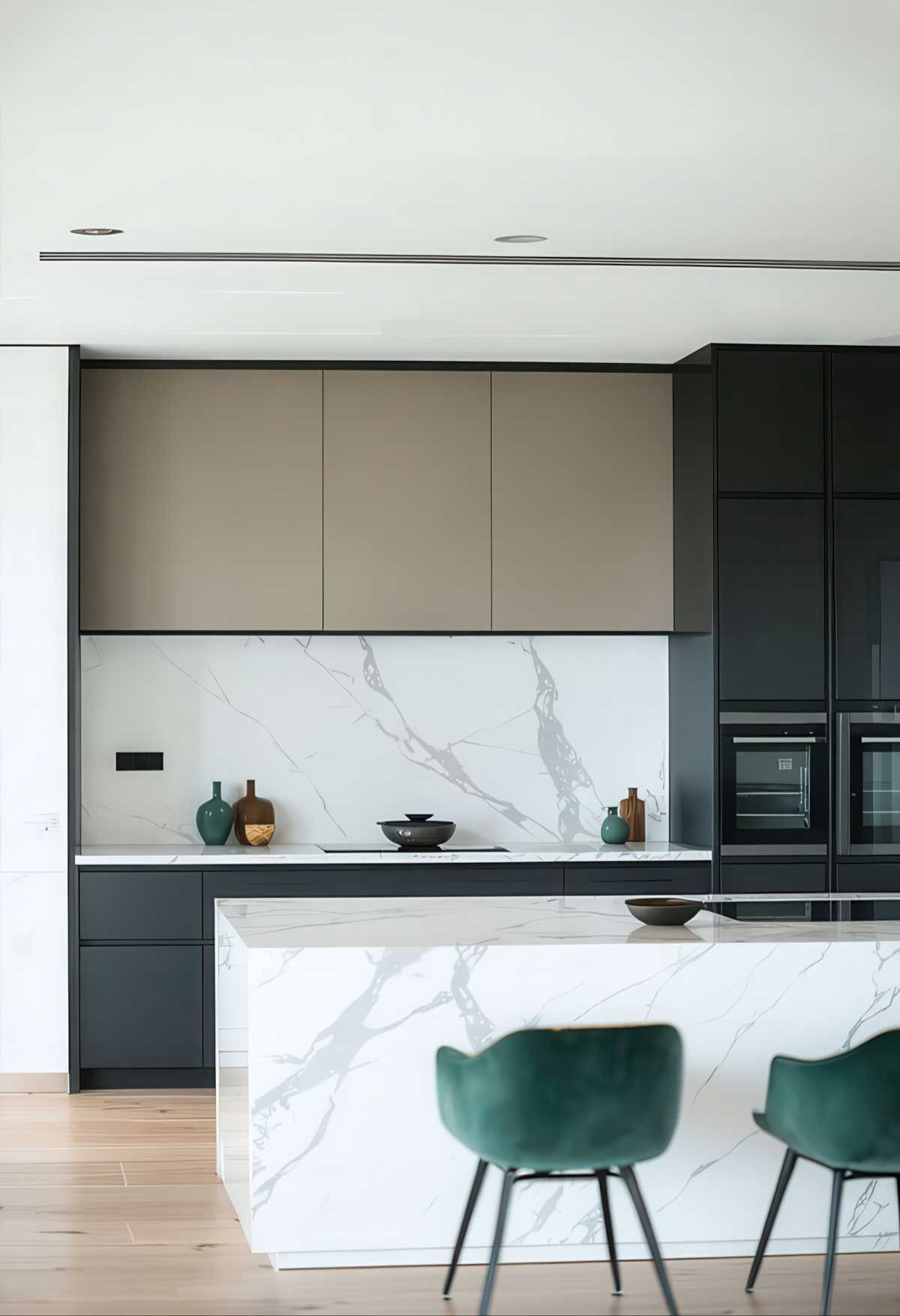 A kitchen with a marble counter top and black cabinets