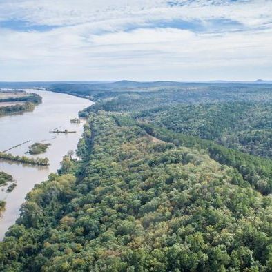 Bigelow AR Criminal Lawyers An aerial view of a river surrounded by trees and mountains.