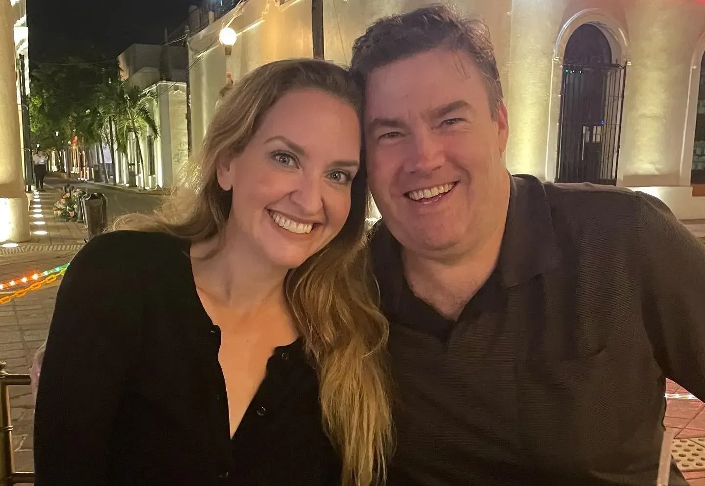 A man and a woman are posing for a picture together.