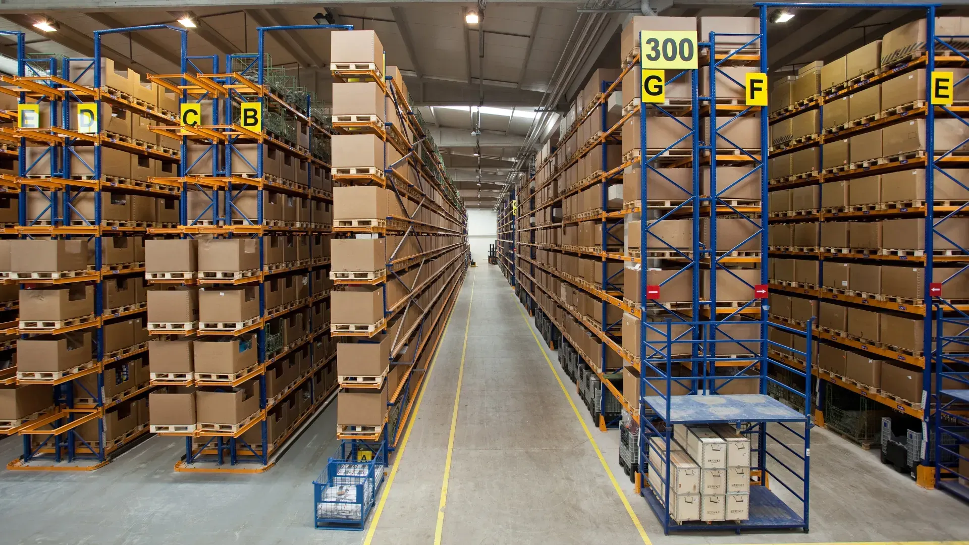 A warehouse filled with lots of boxes and shelves with a yellow sign that says 300