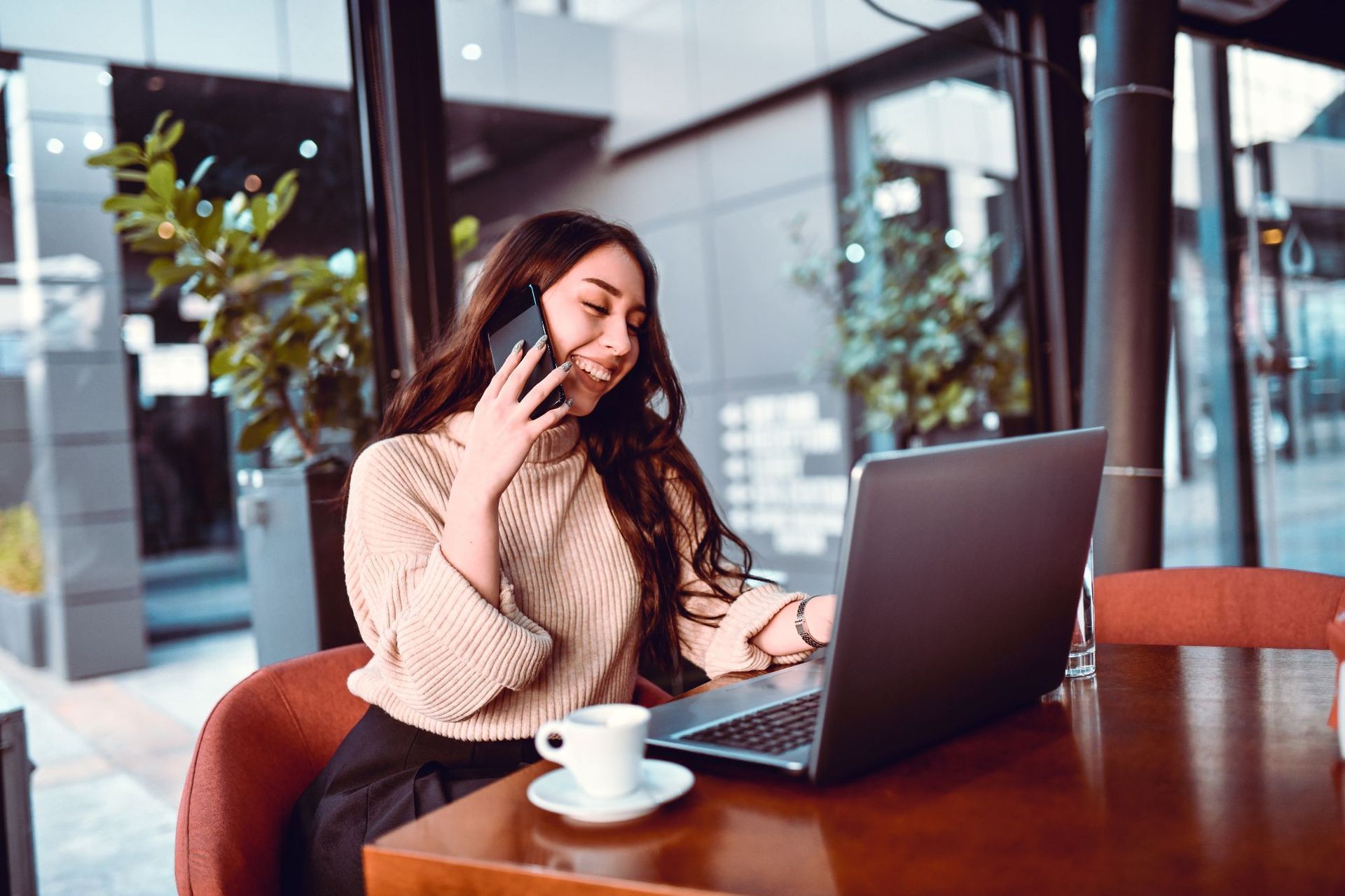 A happy business woman in Adelaide, receiving leads and new sales from her Assurance Digital local area marketing campaigns.