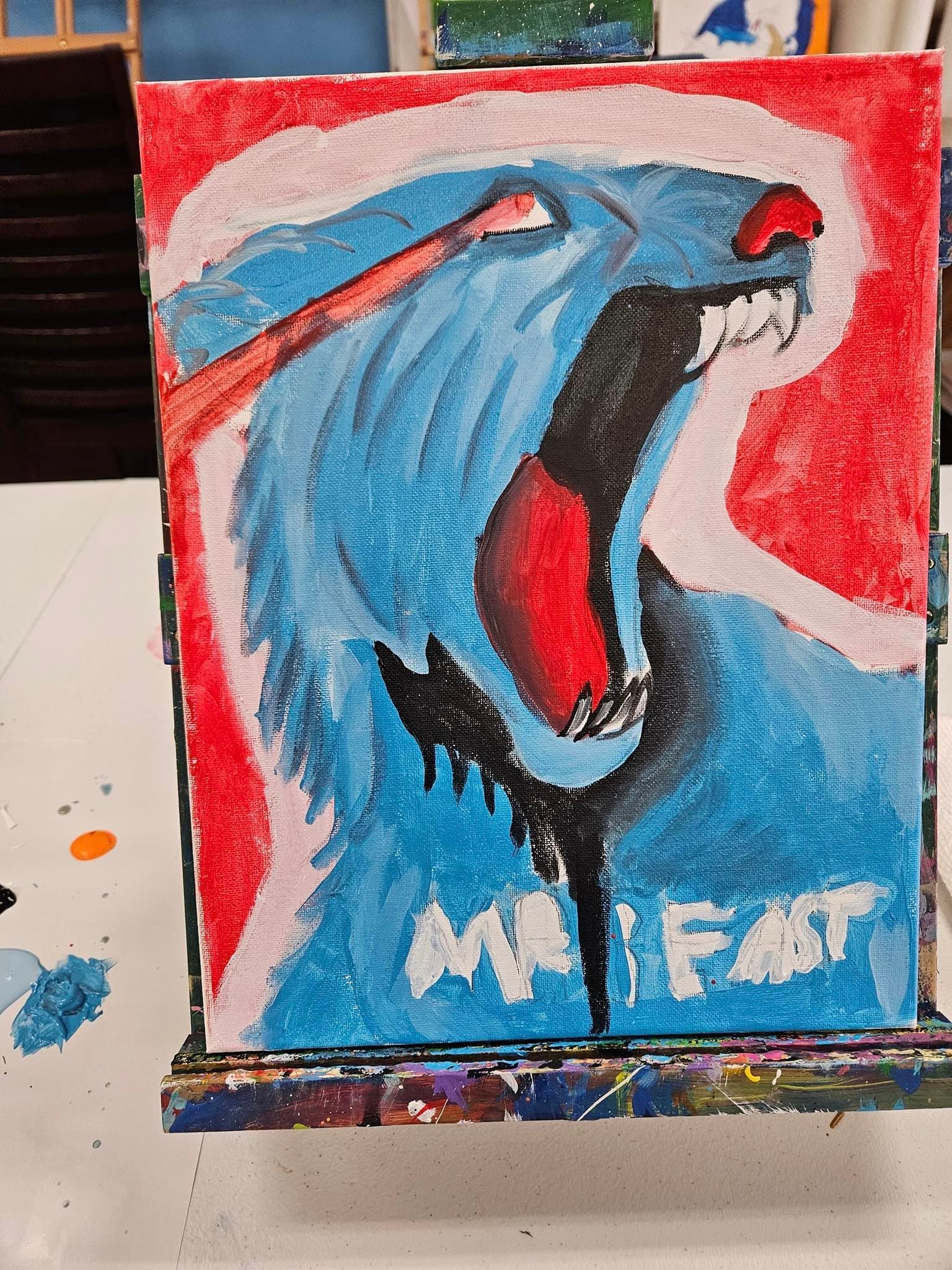 A painting of a shark with the word mr. fast written on it
