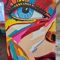 A colorful painting of a woman 's face with a blue eye.