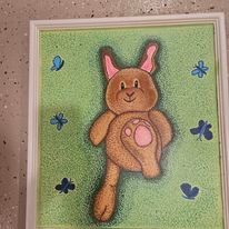 A painting of a stuffed bunny rabbit laying in the grass surrounded by butterflies.